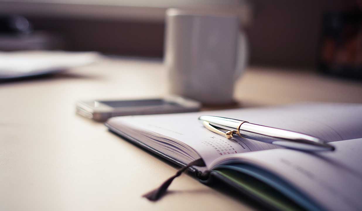 Photo of an open Calendar representing a meeting at the HOA Monthly Meeting